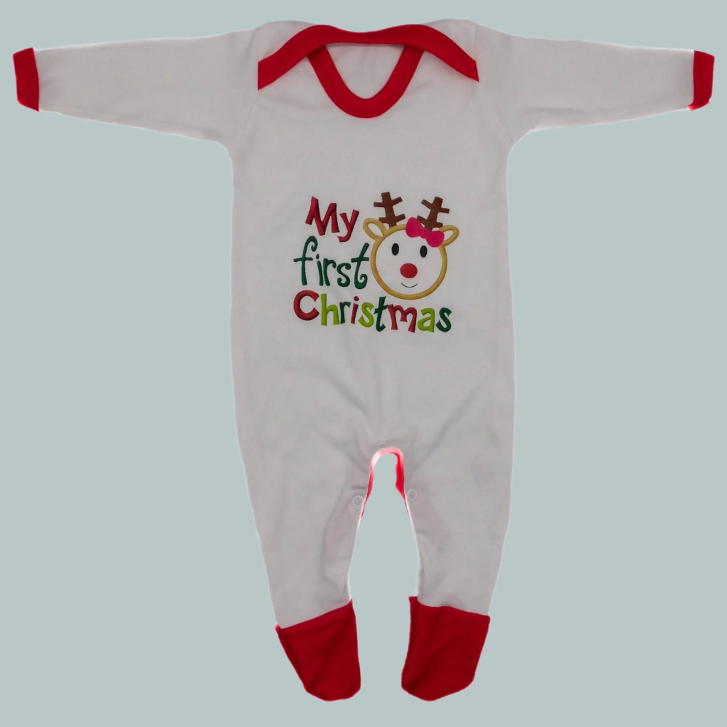 Baby onesie sleepsuit with 'My first Christmas' text and reindeer design on a neutral background