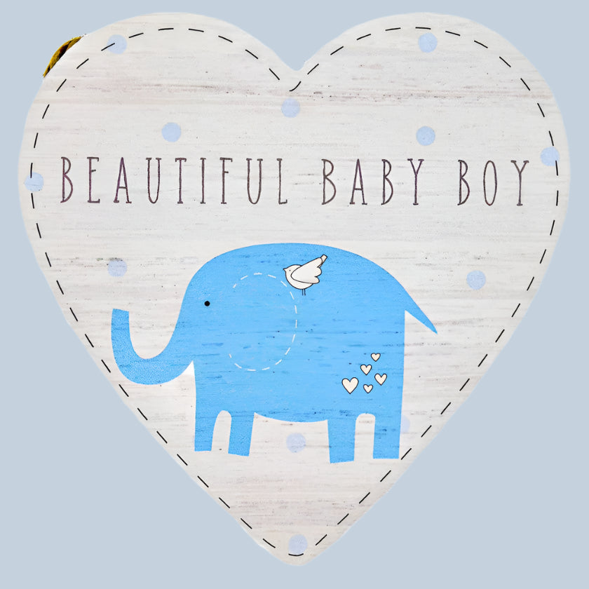 Heart-shaped decorative door plaque with a blue elephant and text on a light blue background
