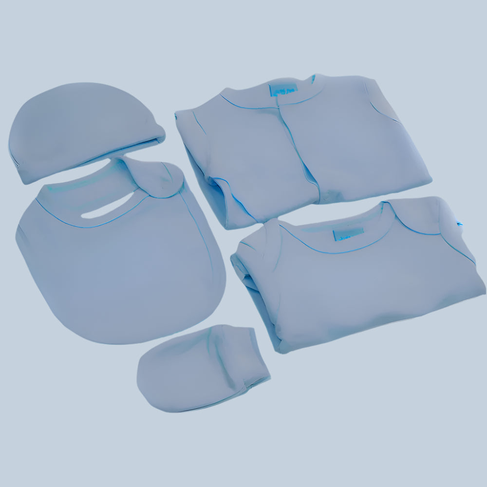 Blue baby clothing set including a hat, bib, sleepsuit, bodysuit, and mittens on a pale blue background.