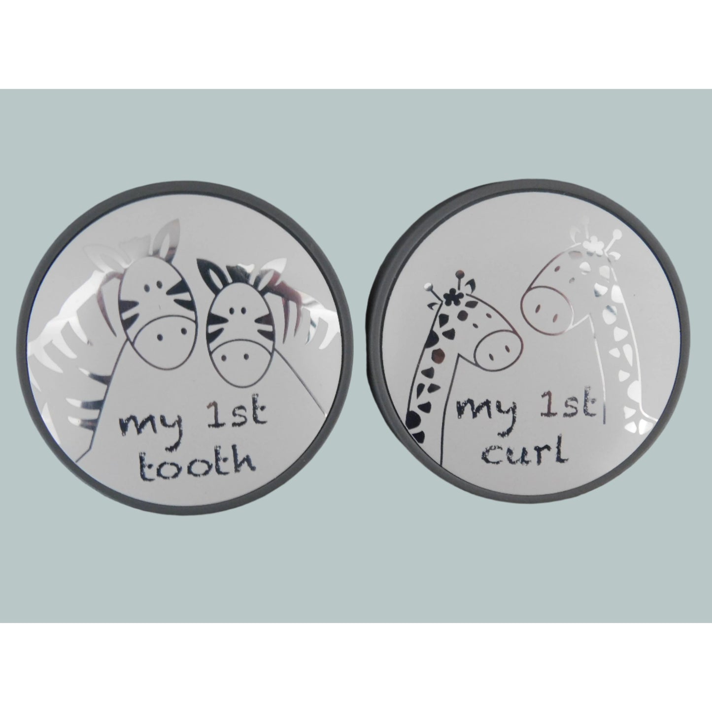 Tooth and curl boxes with silver animal design and wording 'My 1st tooth' and 'My 1st curl'