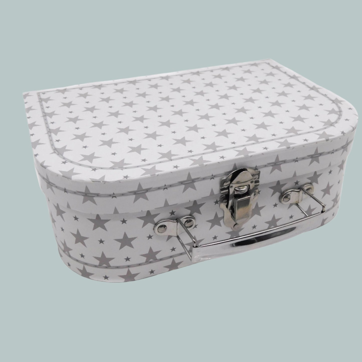 White and grey star-patterned keepsake suitcase on a neutral background
