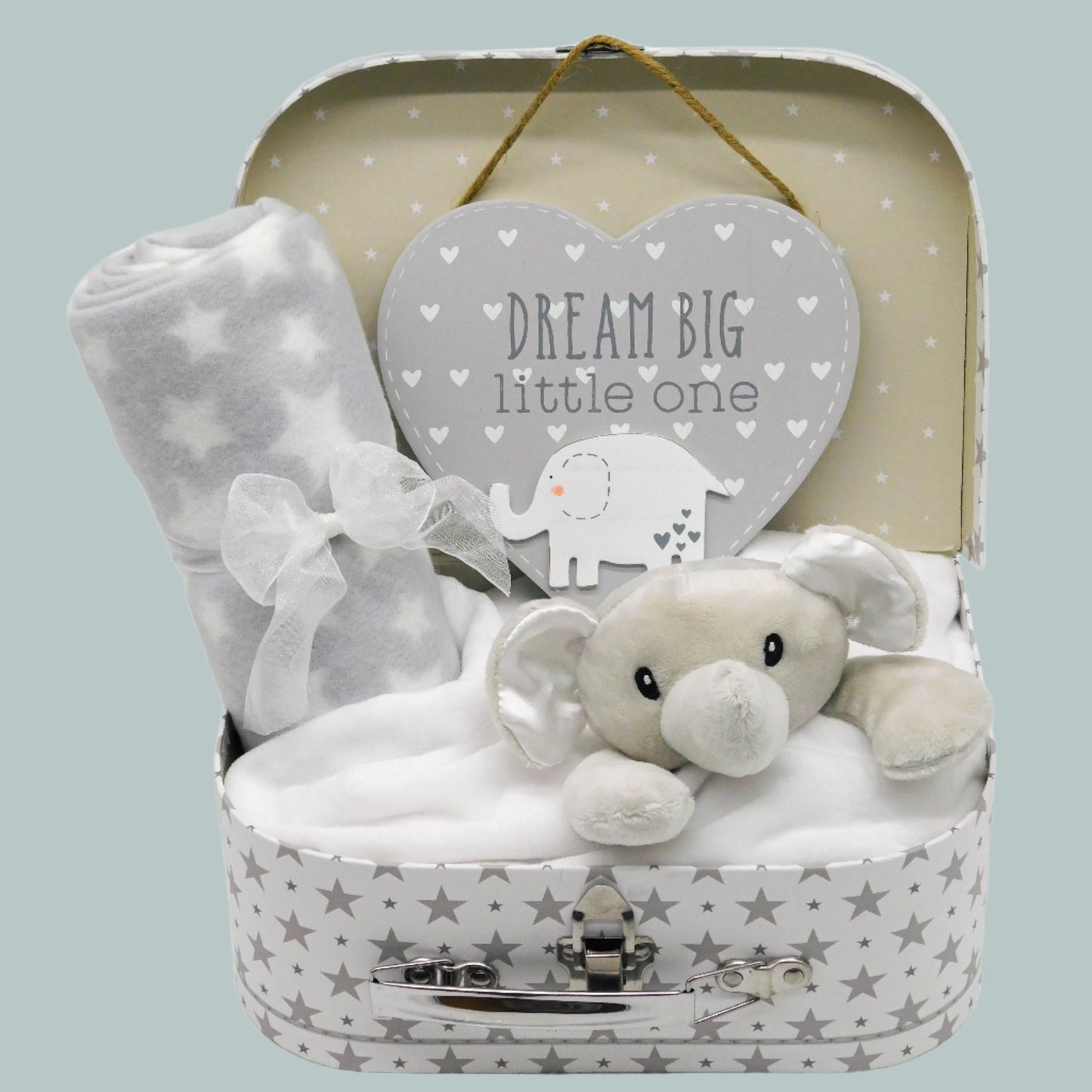 Neutral Baby gift set with plush elephant comforter, fleece blanket, and heart-shaped door-hanging plaque in a star-patterned keepsake suitcase.