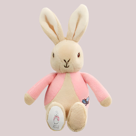 Plush Flopsy Bunny bean rattle toy on a pale pink background