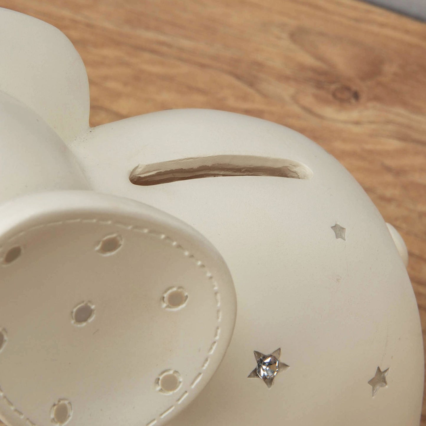 Cream resin elephant money box, showing aperture for money, with diamante decoration