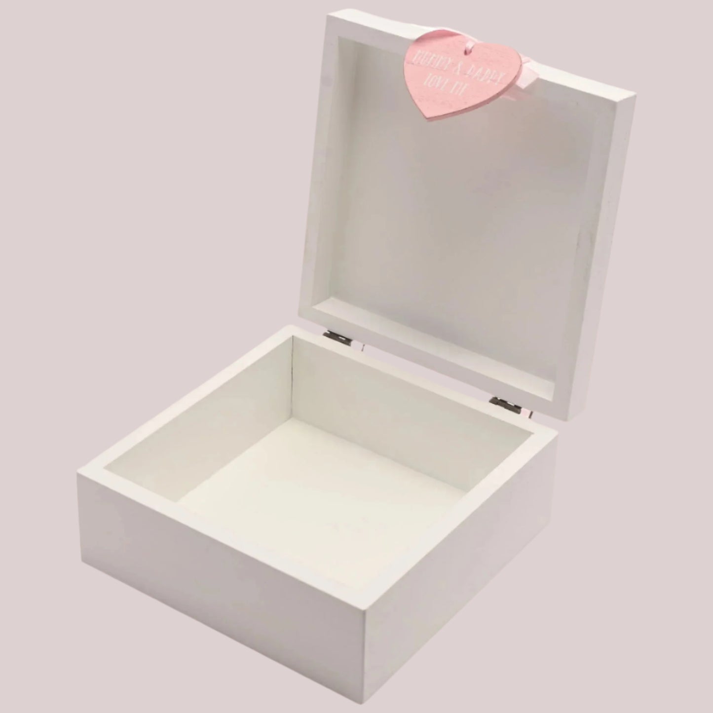 White wooden keepsake box with a pink heart-shaped tag on a white background