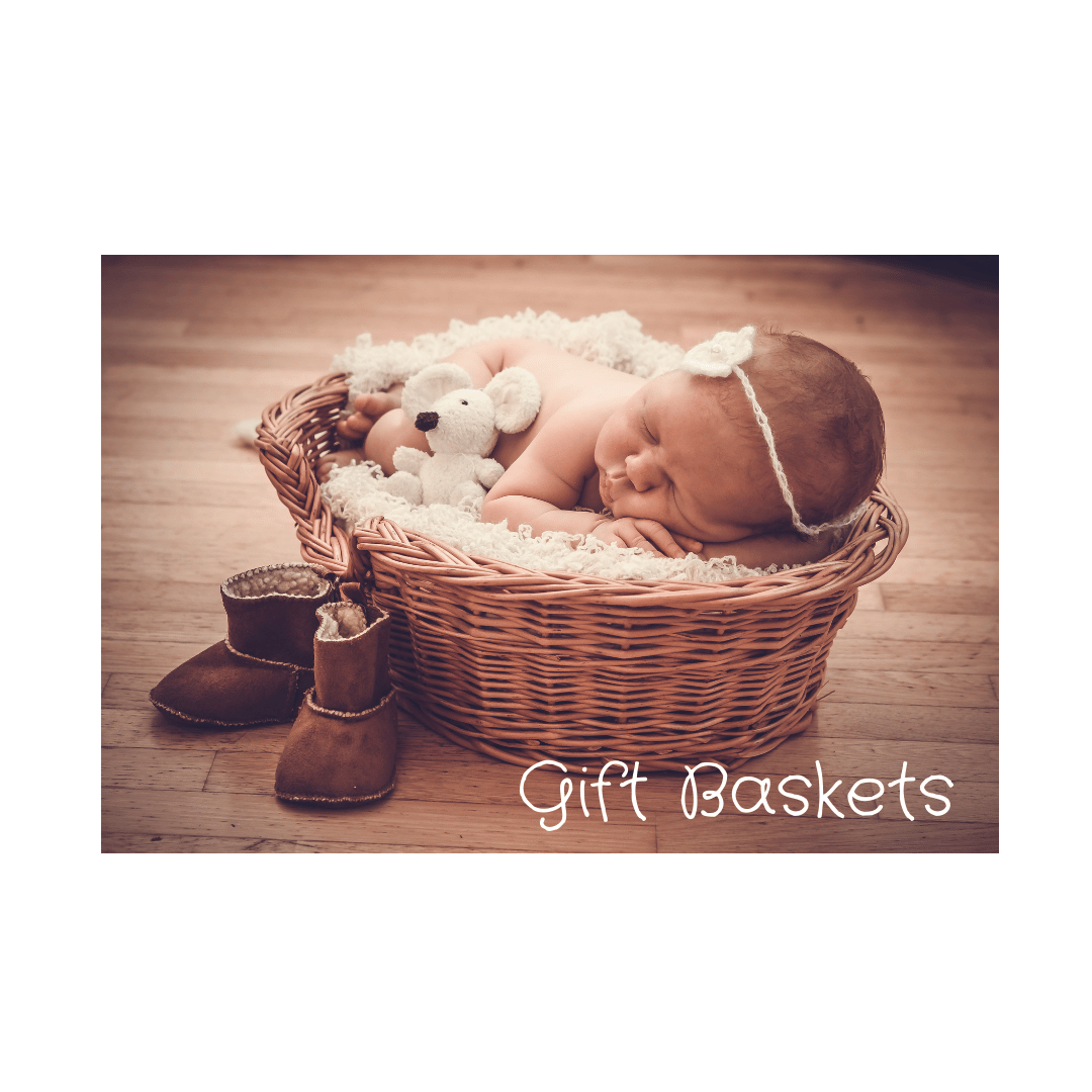 A new baby lying in a wicker basket with a mouse teddy, some boots and the text 'Gift Baskets'