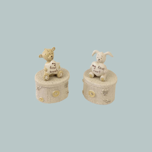 My first tooth and curl boxes with patchwork decoration and Button Corner character teddy and rabbit on a neutral background.