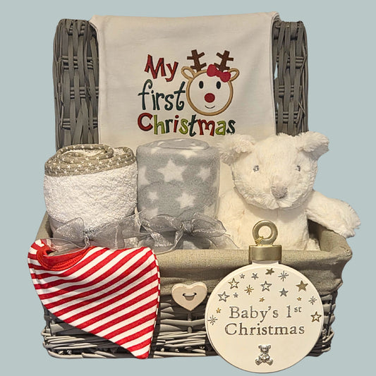 Grey wicker gift basket with 'My first Christmas' romper, towel, blanket, bib, white teddy and keepsake plaque
