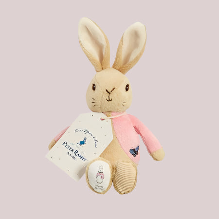 Flopsy Bunny plush bean rattle on a pale pink background