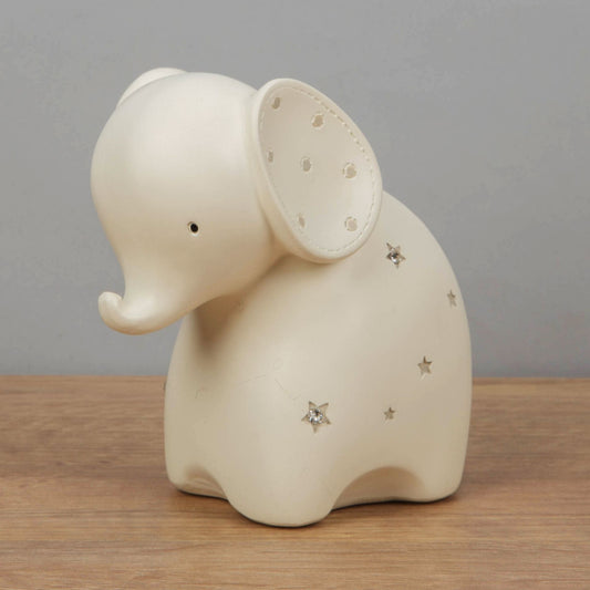 Cream resin elephant money box with diamante star decoration
