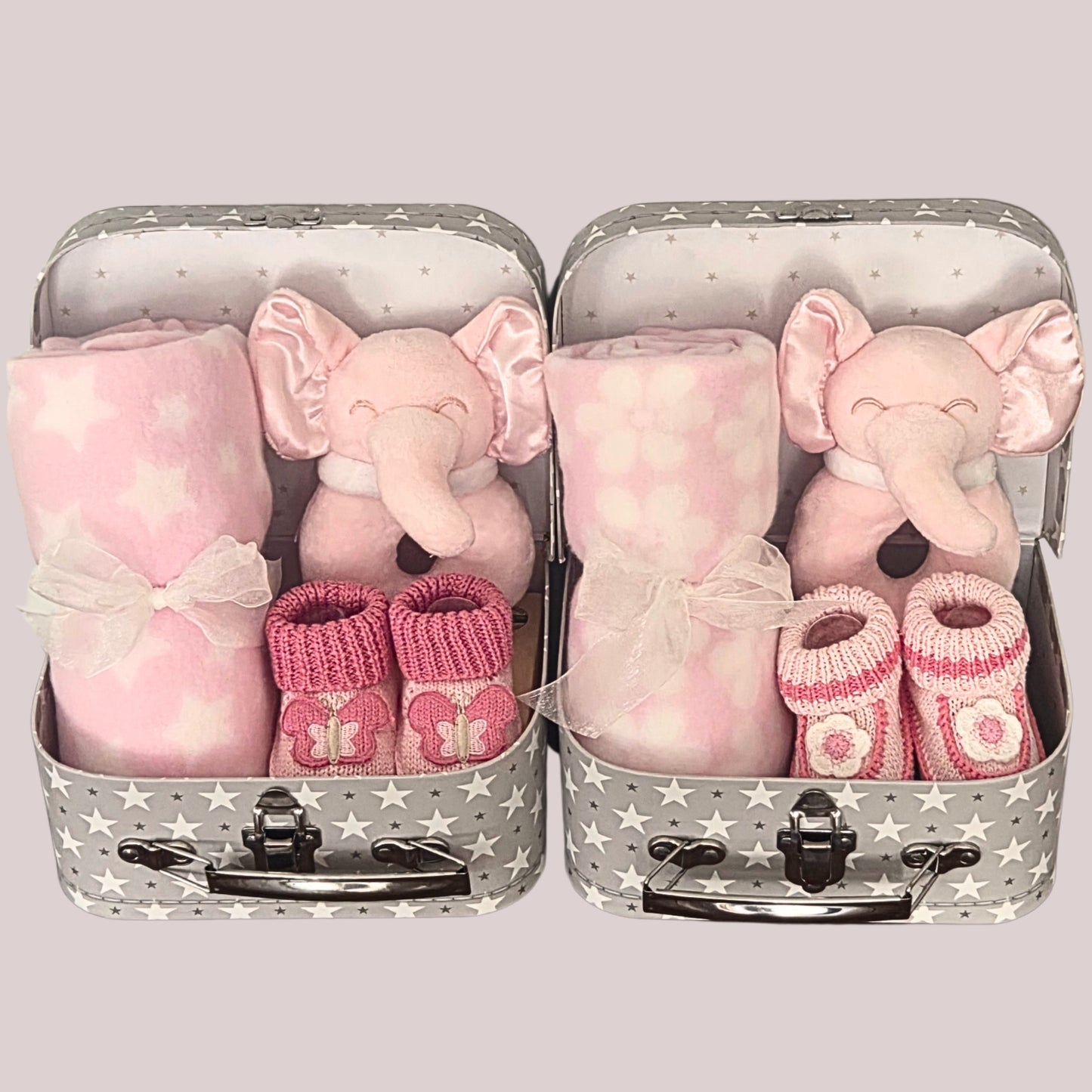 Twin baby girls gift set with two mini suitcases, pink elephant rattles, pink & white blankets and booties
