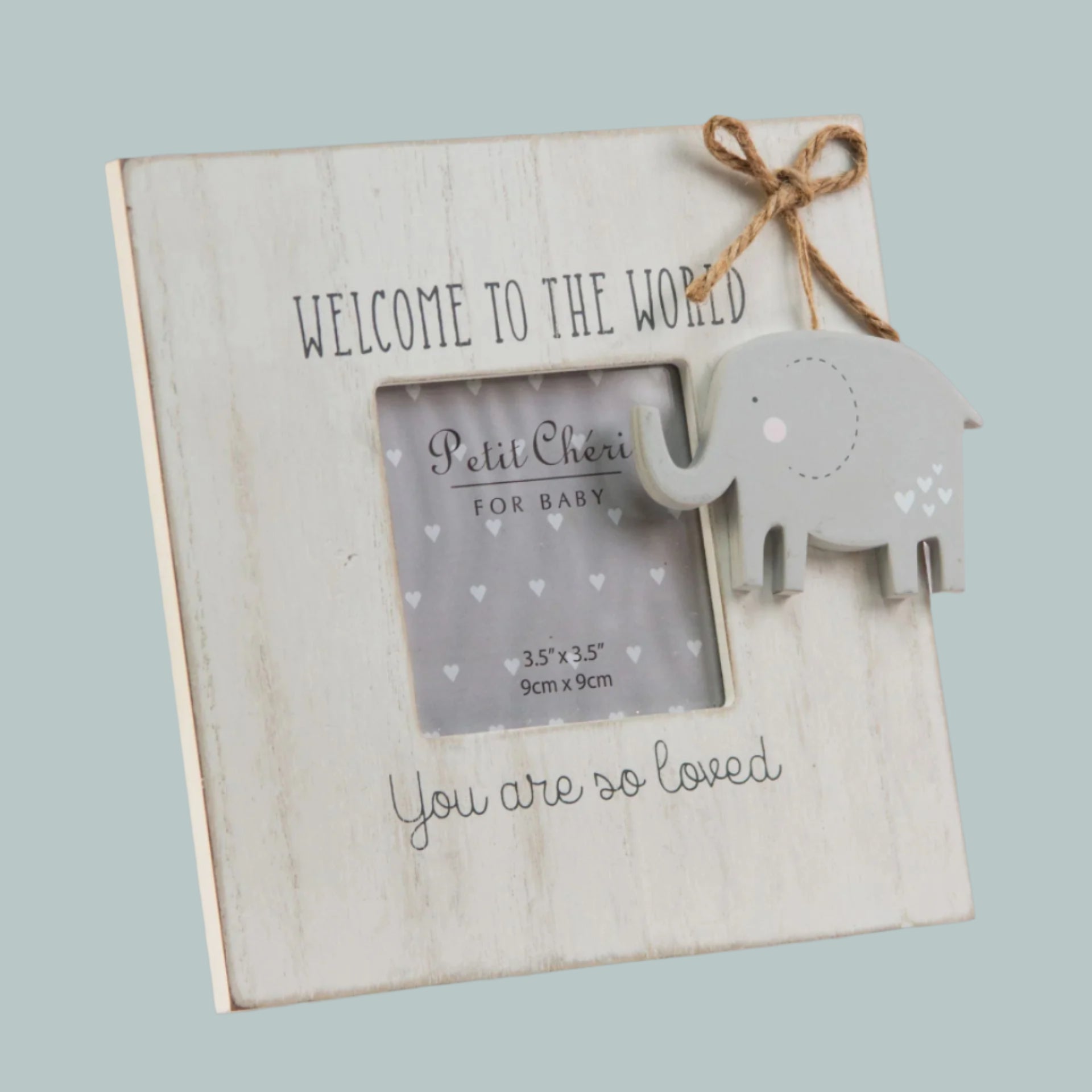 Wooden photo frame with elephant decoration and text 'Welcome to hte World. You are so loved' on a neutral background