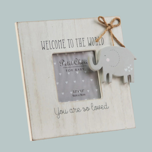 Wooden photo frame with elephant decoration and text 'Welcome to hte World. You are so loved' on a neutral background