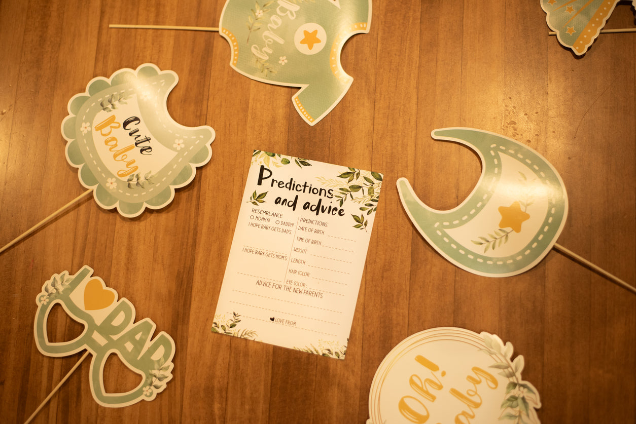 Baby Shower predictions and advice cards on a table